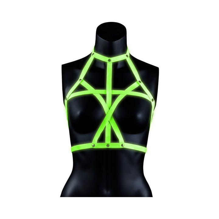 Black mannequin wearing a green glow-in-the-dark adjustable bra harness with strappy bondage design.