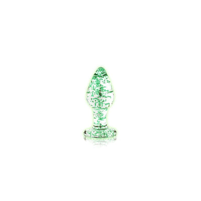 Clear glass butt plug with green glow-in-the-dark speckles and a flared base on a white background.