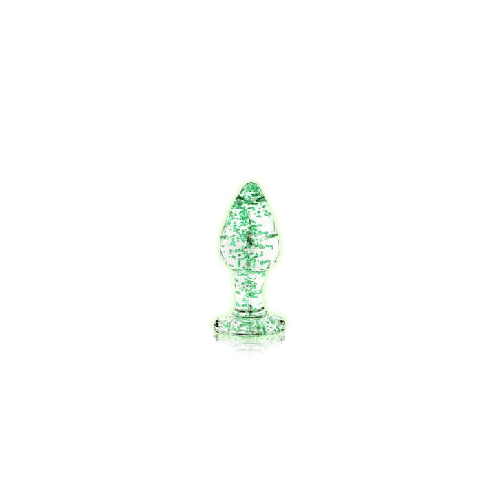 Clear glass butt plug with green glow-in-the-dark speckles and a flared base on a white background.