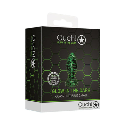 Packaging box for Ouch! Glow in the Dark small glass butt plug with green hexagon design and product image on front.