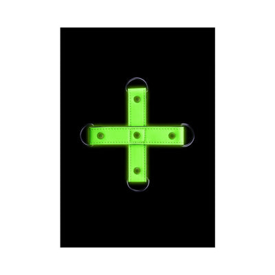 Glow-in-the-dark green hogtie connector with metal rings on black background