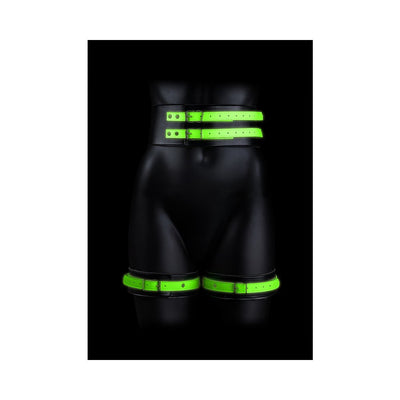 Black mannequin wearing green glow-in-the-dark thigh cuffs and double buckle belt against a black background.