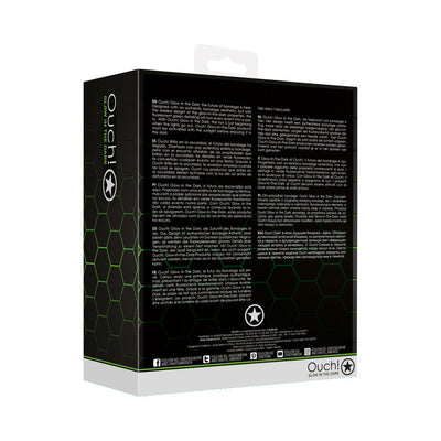 Packaging box of Ouch! Glow Thigh Strap-on in green with glow-in-the-dark features and multilingual product description.