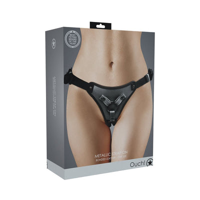 Packaging of the Ouch! Metallic Strap-On Harness showing the black adjustable bonded leather harness on a model.