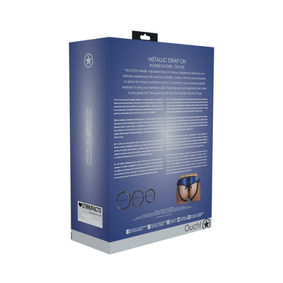 Packaging box of Ouch! Metallic Strap-on Harness with product details and sizing information on a blue background.