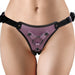 Front view of purple metallic strap-on harness with adjustable black straps and metal rings on model's hips.