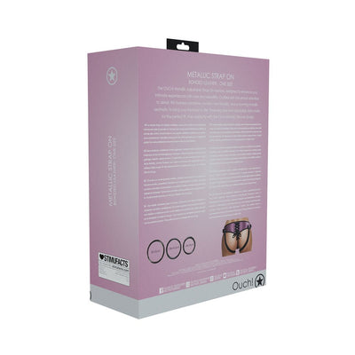 Packaging box for Ouch! Metallic Strap-on Harness with product details and sizing information on a pink background.