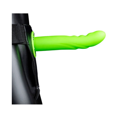 Bright green textured curved hollow strap-on attached to adjustable black waistband on mannequin.