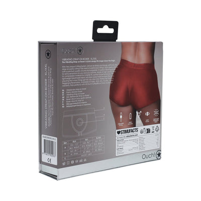 Packaging of Ouch! Vibrating Strap-on Boxer in red, showing product features, size chart, and a rear view of the boxer shorts.