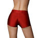 Back view of a person wearing red vibrating strap-on boxer shorts with a smooth, fitted design.