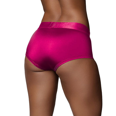 Back view of a model wearing vibrant pink mid-rise strap-on brief with smooth, stretchy fabric.
