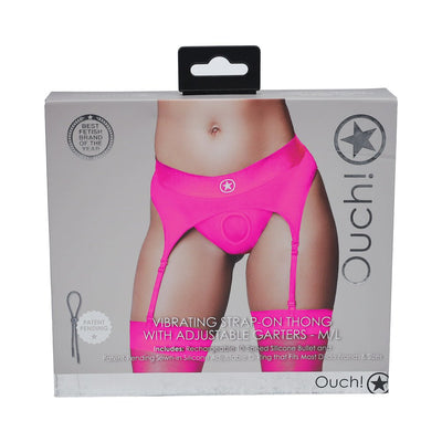 Packaging of Ouch! Vibrating Strap-on Thong in bright pink with adjustable garters shown on a model's lower torso.