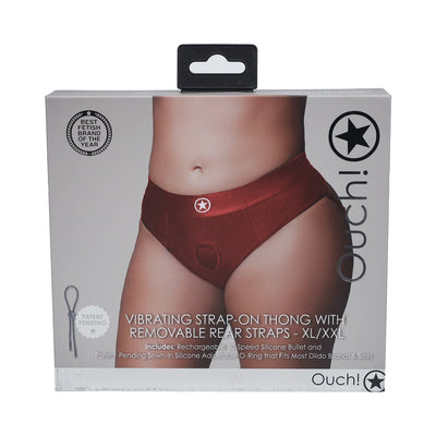 Packaging of Ouch! Vibrating Strap-on Thong in red with removable rear straps, shown on a model's waist and hips.
