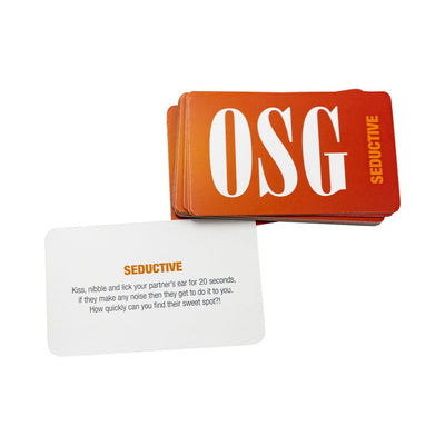 Stack of orange OSG Seductive game cards with one card showing a playful intimate challenge for couples.