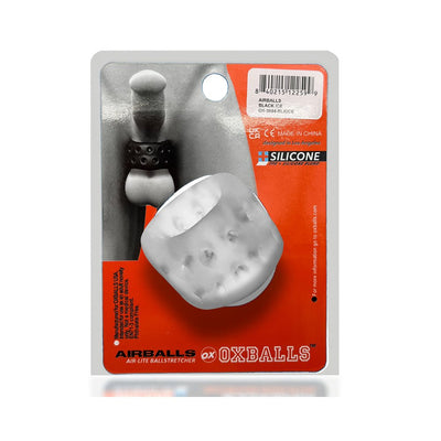 Airballs Air-Lite black silicone ballstretcher with ventilation holes in orange and gray packaging by Oxballs.