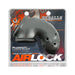 Gray vented Airlock Air-Lite chastity cage made of soft silicone displayed on branded packaging.