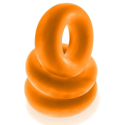 Three stacked bright orange jumbo cockrings made of soft, stretchy Flextpr material on white background.