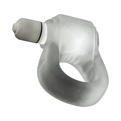 Clear silicone cock ring with attached small bullet vibrator labeled Reverb, designed for ergonomic fit and stimulation.