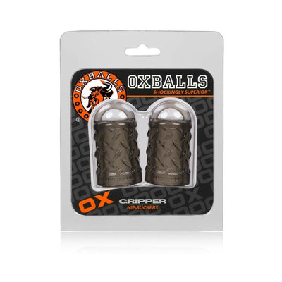 Oxballs Gripper nipple pullers in smoke color with textured design, packaged in a clear blister pack.
