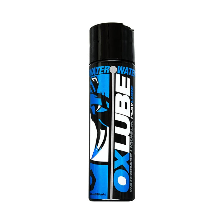 Bottle of Oxballs Liquislik water-based lubricant with black cap and blue, black, and white label design.