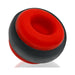 Red and black silicone ballstretcher with a hollow center and textured grip ring design.