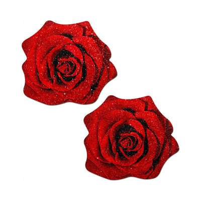 Pair of red glitter velvet rose-shaped nipple pasties with detailed petal design on white background.