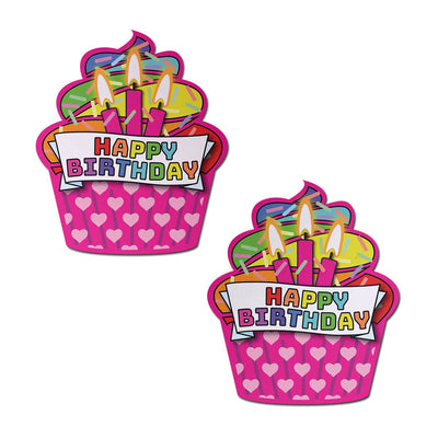 Pair of colorful cupcake-shaped nipple pasties with "Happy Birthday" text and lit candles design