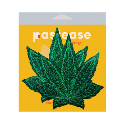 Green glitter pot leaf shaped fuller coverage pasties on yellow Pastease branded packaging.
