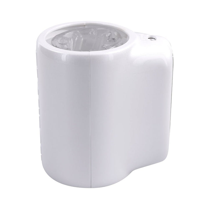 Compact white personal massager with textured clear inner sleeve and ergonomic design.