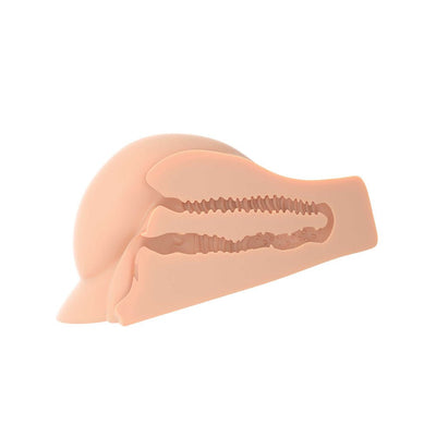 Cross-section view of a flesh-toned XL masturbator with textured dual internal tunnels for varied stimulation.