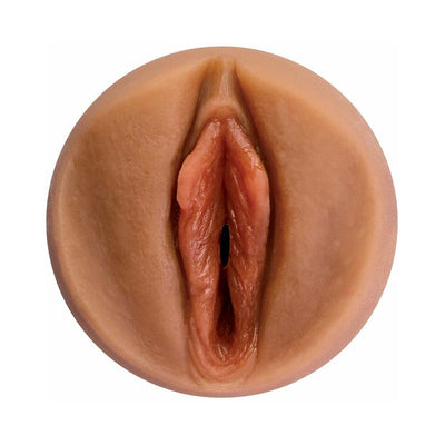 Close-up view of a realistic tan-colored silicone sleeve designed for discreet male pleasure use.
