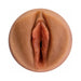 Close-up view of a realistic tan-colored silicone sleeve designed for discreet male pleasure use.