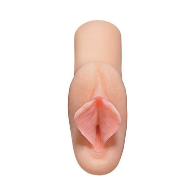 Top view of a lifelike, compact pocket stroker in soft flesh tone with detailed texture and realistic design.