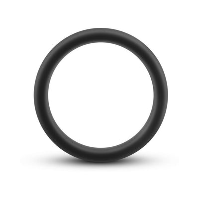 Black silicone cock ring with smooth matte finish, circular and flexible for comfortable fit and performance.