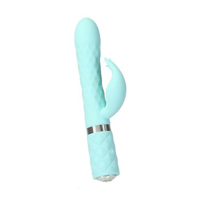 Light blue dual stimulator with textured shaft, curved design, clitoral attachment, and quilted handle with silver accent ring.