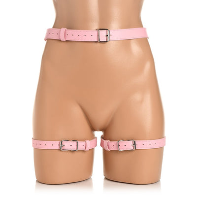 Pink adjustable faux leather thigh harness and waist belt with metal buckles displayed on a mannequin torso.