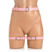 Pink adjustable faux leather bondage thigh harness with waist and thigh straps on a mannequin.
