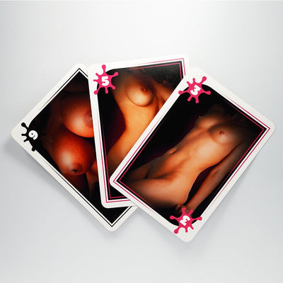 Three playing cards from the Bigger or Smaller Boobs Card Game featuring artistic nude images with numbered breast size rankings.
