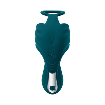 Deep teal rechargeable silicone thrusting anal plug with vibrating ball cradle and power button detail