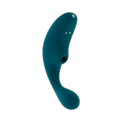 Deep teal dual vibrator with curved shaft and clitoral suction feature, made of smooth body-safe silicone.