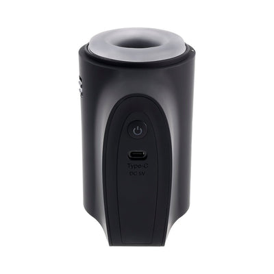 Black travel-sized stroker with soft gray dual-entry openings and USB-C charging port on front panel.