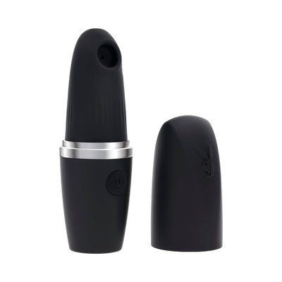 Black rechargeable silicone clitoral suction vibrator with removable cap and silver accent ring.