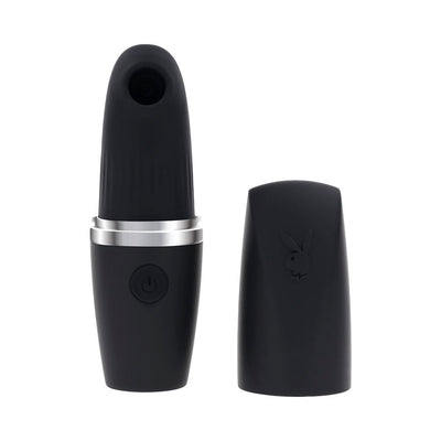 Black rechargeable silicone suction vibe with silver accent and removable cap embossed with Playboy bunny logo.