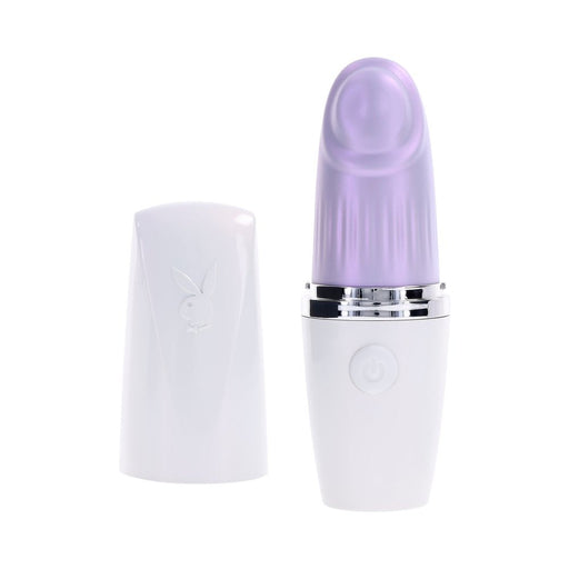 Playboy Getaway white and opal tapping toy with removable cap and one-button control on white background.