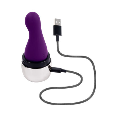 Purple silicone vibrator with curved tip in a silver charging case connected to a USB cable on a white background.