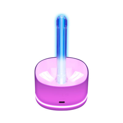 Playboy Twist & Stroke Frost device in purple charging dock with glowing blue and white light accents