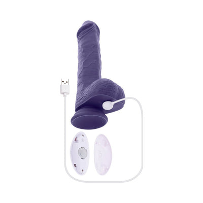 Purple large thrusting vibrator with suction base, USB charging cable, and white ergonomic remote control with battery compartment open.