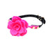 Pink silicone rose flower ball gag with adjustable black strap and gold-tone hardware on white background