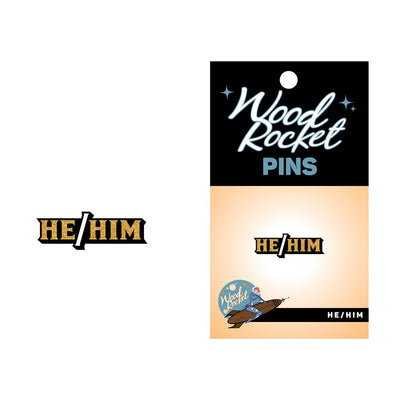 Gold glitter He/Him enamel lapel pin on Wood Rocket branded backing card.