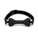 Black bone-shaped silicone gag with adjustable leather strap and buckle closure on white background.